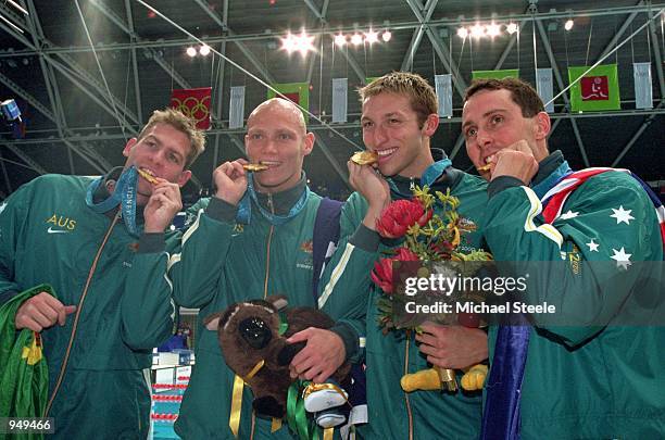 Todd Pearson, Michael Klim, Ian Thorpe and William Kirby of the Australian Men's 4x200m Freestyle Relay Team celebrate gold after setting a new world...