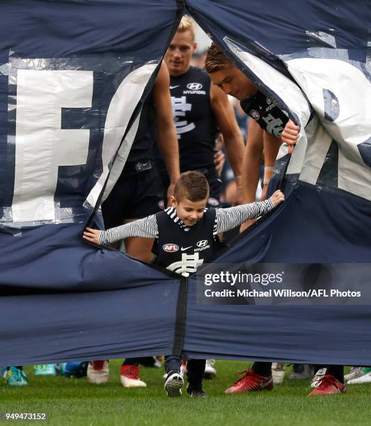 The Blues mascot breaks through the banner during the 2018 AFL round five match between the Carlton Blues and the West Coast Eagles at the Melbourne...