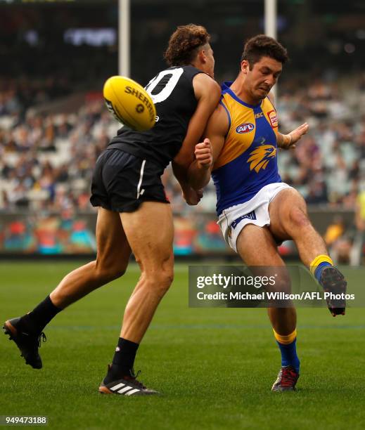 Tom Barrass of the Eagles and Charlie Curnow of the Blues in action during the 2018 AFL round five match between the Carlton Blues and the West Coast...