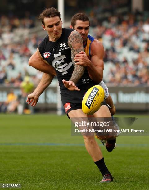 Aaron Mullett of the Blues is tackled by Jack Darling of the Eagles during the 2018 AFL round five match between the Carlton Blues and the West Coast...