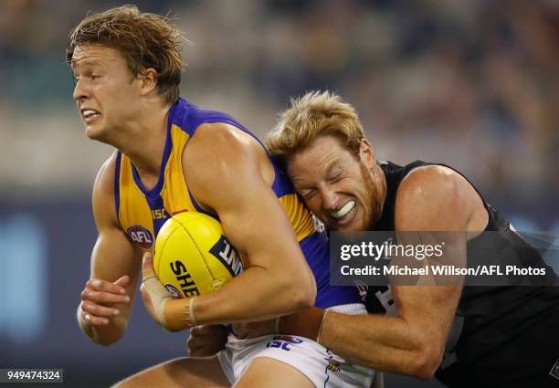 Jackson Nelson of the Eagles is tackled by Andrew Phillips of the Blues during the 2018 AFL round five match between the Carlton Blues and the West...