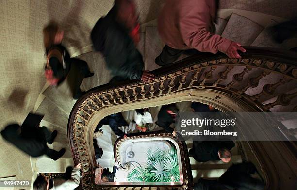 Job seekers walk up a staircase as they enter a career fair sponsored by National Career Fairs in New York, U.S., on Wednesday, Feb. 18, 2009. The...