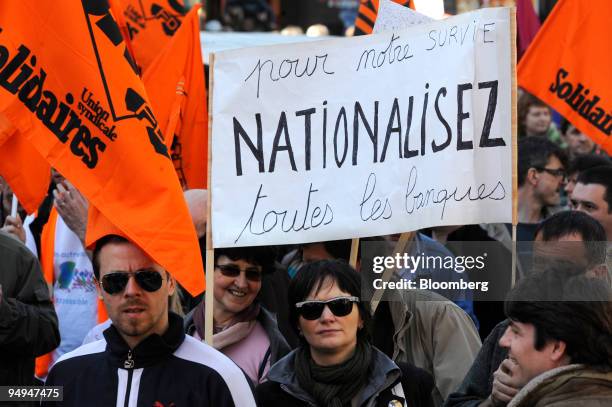 Banner calls for nationalization of all banks at a protest during general strikes in Paris, France, on Thursday, March 19, 2009. About 50 percent of...