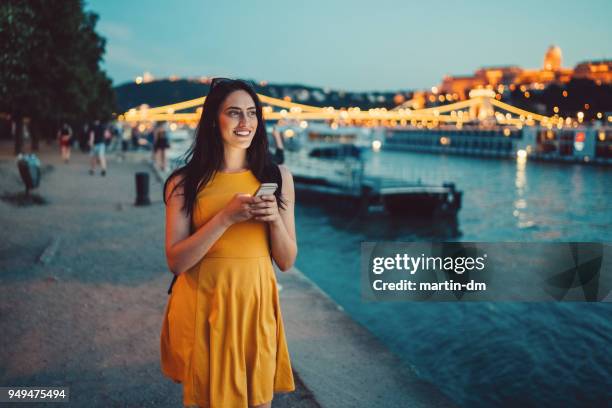 beautiful woman in budapest using phone - hungary summer stock pictures, royalty-free photos & images