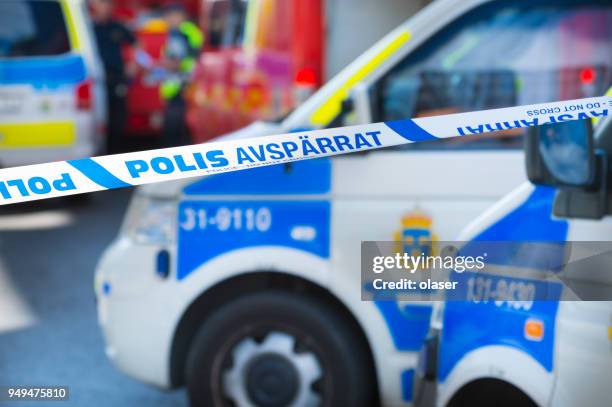 ambulances and police cars in stockholm, police line, do not cross - sweden police stock pictures, royalty-free photos & images