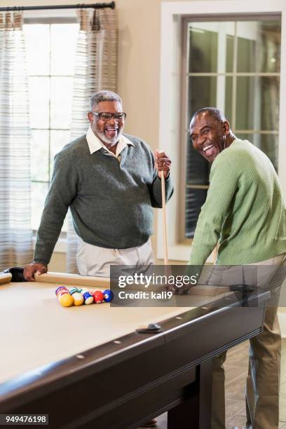 two african-american men shooting pool - black cue ball stock pictures, royalty-free photos & images