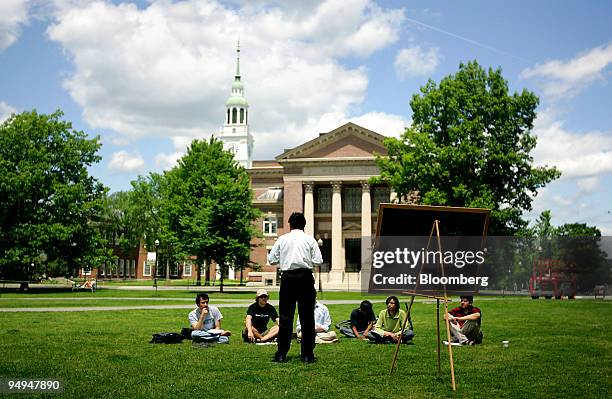 Group of students meet on the lawn outside Webster Hall on the campus of Dartmouth College, the smallest school in the Ivy League, in Hanover, New...