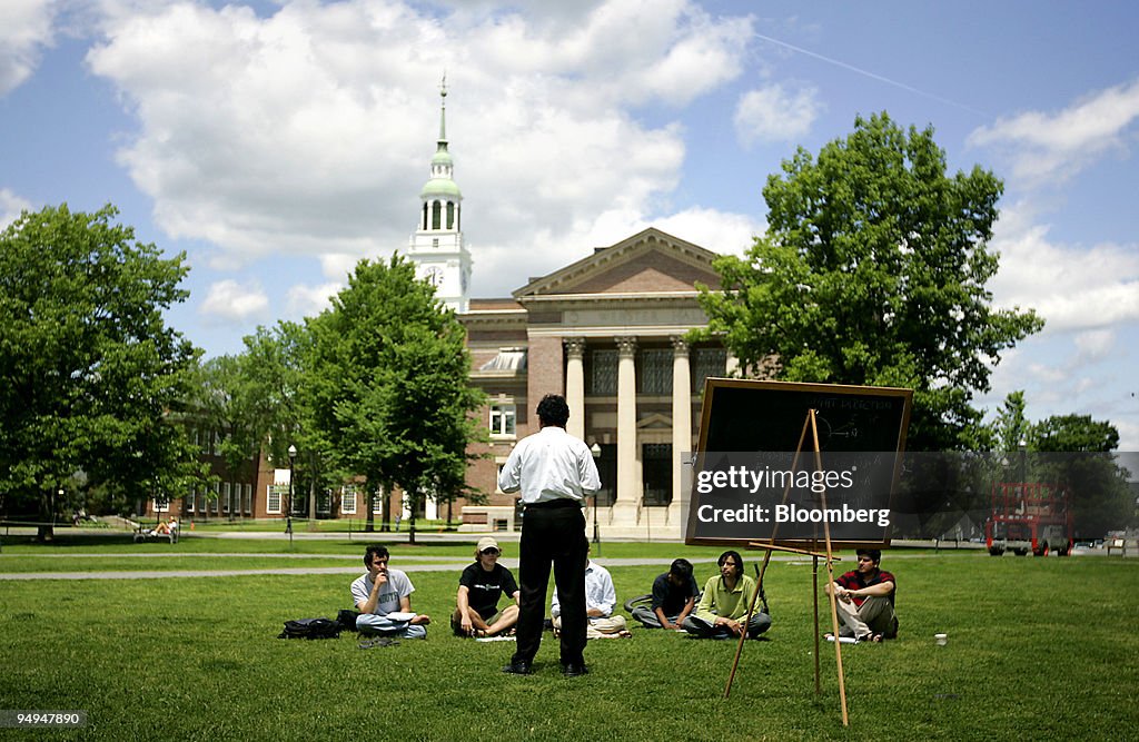 A group of students meet on the lawn outside Webster Hall on