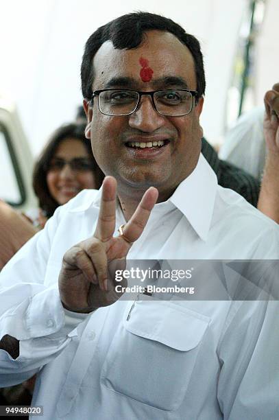 Ajay Maken, candidate for the Congress party, flashes a victory sign at a vote counting center in New Delhi, India, on Saturday, May 16, 2009. Prime...