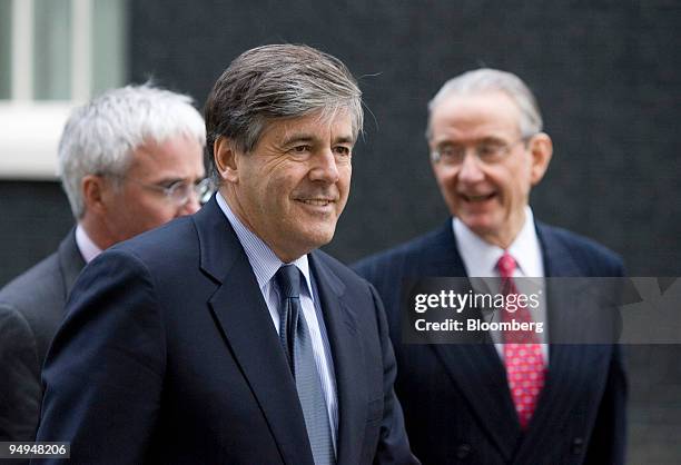 Josef Ackermann, chief executive officer of Deutsche Bank, foreground, with Peter Sands, chief executive officer of Standard Chartered Plc, left, and...