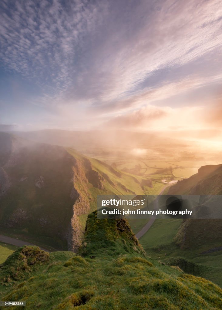 Rock and mist on Winnats Pass at sunrise, English Peak District. UK.