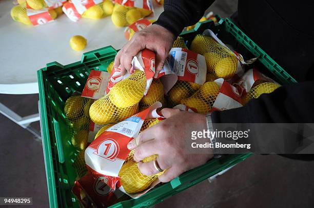 Packs of lemons are prepared for shipment at a farm in Aprilia, south of Rome, Italy, on Friday, April 24, 2009. European Union agricultural income...