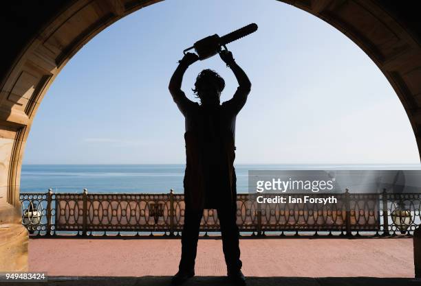 Visitor dressed as the character Leatherface from the movie Texas Chainsaw Massacre poses during the Scarborough Sci-Fi event held at the seafront...