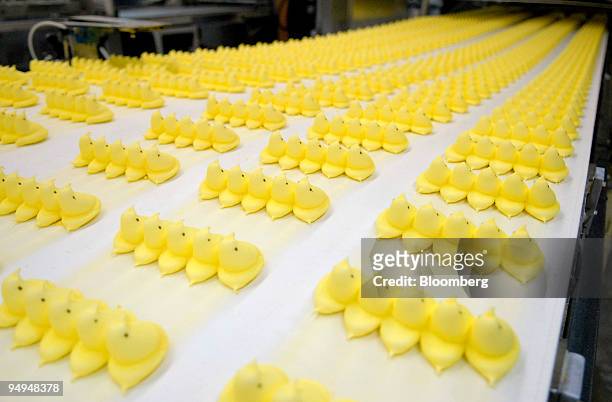 Marshmallow candy Peeps chicks move down a conveyor belt to be boxed and shipped inside the Just Born Inc. Manufacturing facility in Bethlehem,...