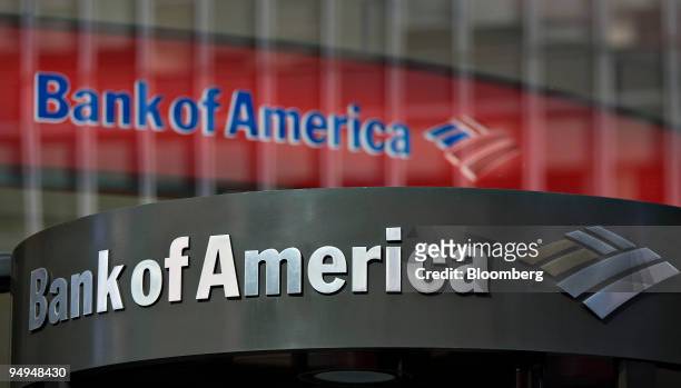 Bank of America logo hangs above a bank branch entrance in New York, U.S., on Monday, Feb. 23, 2009. Citigroup Inc. And Bank of America Corp., two of...
