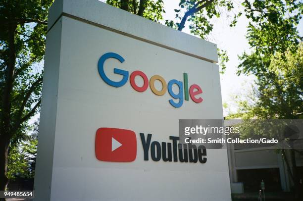 Sign with logos for Google and the Google owned video streaming service YouTube at the Googleplex, the Silicon Valley headquarters of search engine...