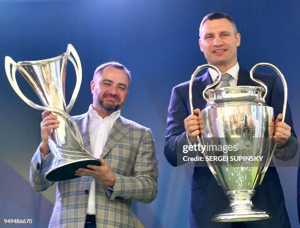 President of the Football Federation of Ukraine Andriy Pavelko and Mayor of Kiev and former boxing champion Vitali Klitschko hold men's and the...