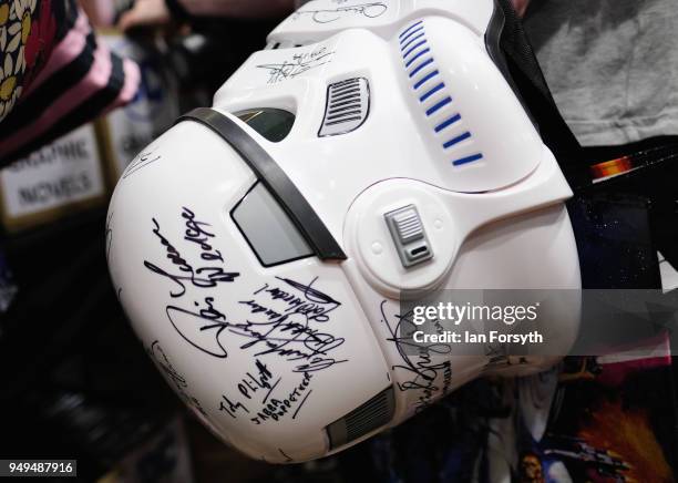 Visitor carries an autographed Storm Trooper helmet during the Scarborough Sci-Fi event held at the seafront Spa Complex on April 21, 2018 in...