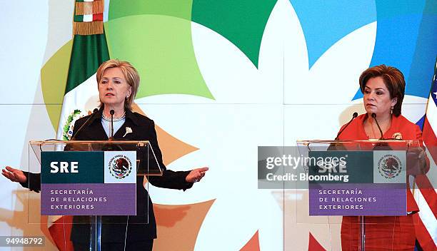 Hillary Clinton, U.S. Secretary of state, left, speaks as Patricia Espinosa, Mexico's foreign minister, listens during a news conference in Mexico...