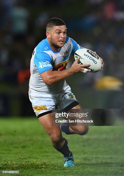 Ash Taylor of the Titans runs the ball during the round seven NRL match between the North Queensland Cowboys and the Gold Coast Titans at 1300SMILES...
