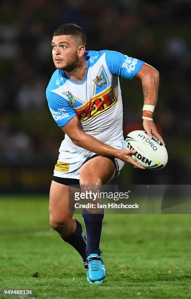 Ash Taylor of the Titans looks to pass the ball during the round seven NRL match between the North Queensland Cowboys and the Gold Coast Titans at...