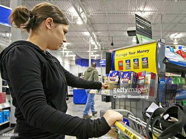 Becky Dayton looks at TurboTax tax software at a Best Buy Co. Store in Orem, Utah, U.S., on Wednesday, March 25, 2009. Best Buy, the largest U.S....