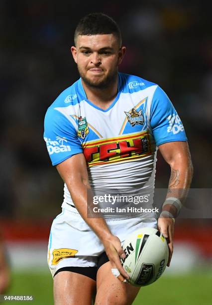 Ash Taylor of the Titans looks to kick the ball during the round seven NRL match between the North Queensland Cowboys and the Gold Coast Titans at...