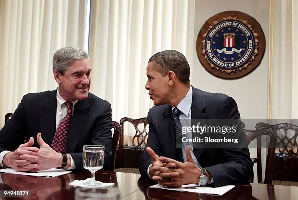 President Barack Obama, right, meets with Robert Mueller, director of the Federal Bureau of Investigation, at FBI headquarters in Washington, D.C.,...