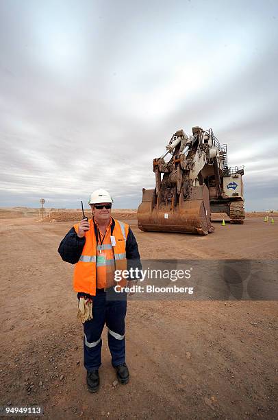 Worker David Nash responds to a walkie-talkie message at the new OZ Minerals Ltd. Prominent Hill mine in South Australia, on Sunday, May 24, 2009. OZ...