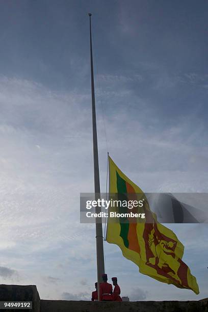 Soldiers lower a Sri Lankan flag in Colombo, Sri Lanka, on Thursday, June 4, 2009. Sri Lanka's navy said it seized a ship that entered the country's...