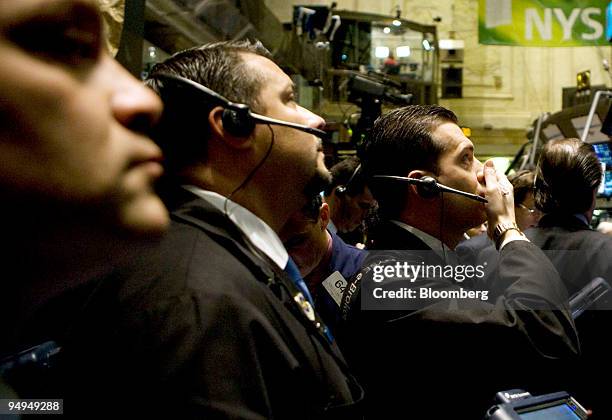 Traders work on the floor of the New York Stock Exchange in New York, U.S., on Friday, April 3, 2009. U.S. Stocks retreated for the first time in...