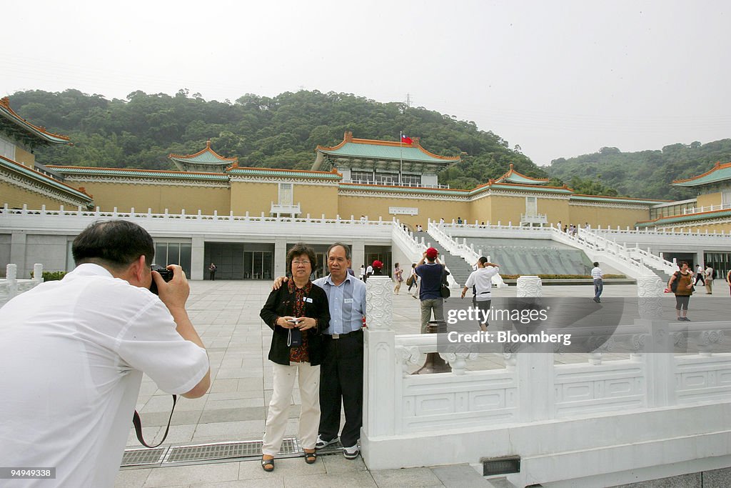 Tourists take pictures outside the Taiwan National Palace Mu