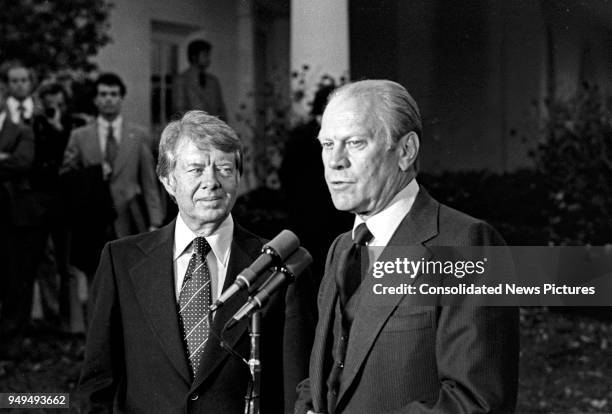 American politicians US President-Elect Jimmy Carter and US President Gerald Ford talk to press outside the White House, Washington DC, November 22,...