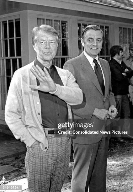 View of American politicians US President-Elect Jimmy Carter and US Vice President-Elect Walter Mondale as they share a laugh prior to a press...