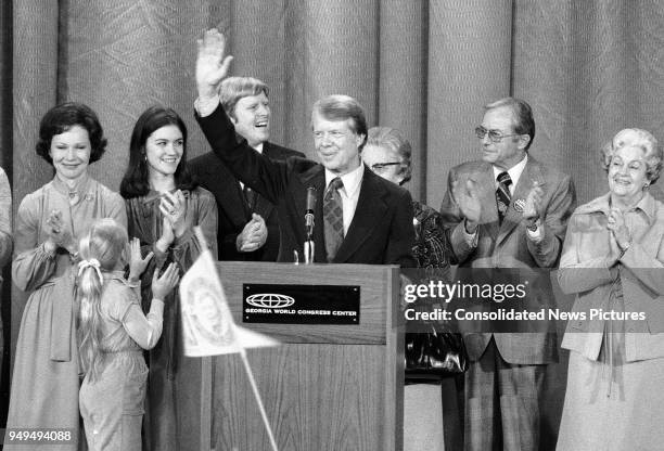 American politician US President-Elect Jimmy Carter waves from the stage at the Georgia World Congress Center where he delivered his Presidential...