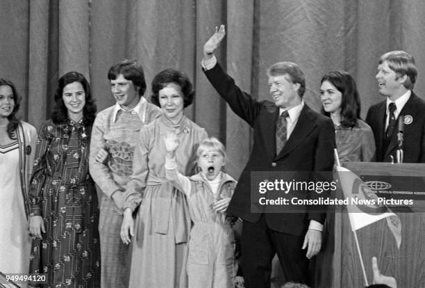 View of future First Lady Rosalynn Carter , daughter Amy, and husband, US President-Elect Jimmy Carter, as they wave from the stage at the Georgia...