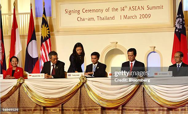 Leaders from the Association of Southeast Asian Nations take part in a signing ceremony at the 14th ASEAN Summit in Cha-am, Thailand, on Sunday,...