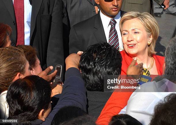 Hillary Clinton, U.S. Secretary of state, shakes hands with people outside of the Basilica of Guadalupe in Mexico City, Mexico, on Thursday, March...