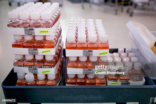 Bottles of refeed medium that will be used to culture respiratory viruses when testing for viruses including the H1N1 influenza A strain, originally...