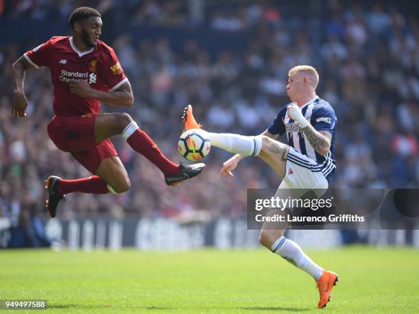 Joe Gomez of Liverpool competes for the ball with James McClean of West Bromwich Albion during the Premier League match between West Bromwich Albion...