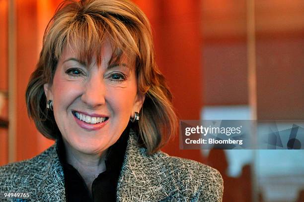 Carly Fiorina, former chief executive officer of Hewlett-Packard Co., stands for a photo before a television interview in Washington, D.C., U.S., on...