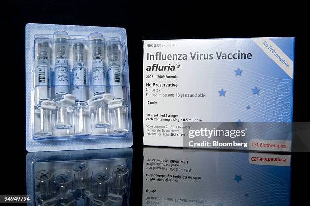 Biotherapies Afluria influenza virus vaccines are arranged for a photo at New London Pharmacy in New York, U.S., on Tuesday, April 28, 2009. It's up...