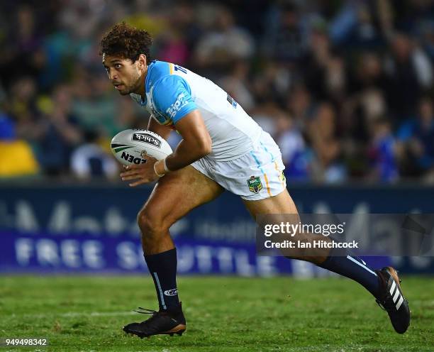 Tyronne Roberts-Davis of the Titans runs the ball during the round seven NRL match between the North Queensland Cowboys and the Gold Coast Titans at...