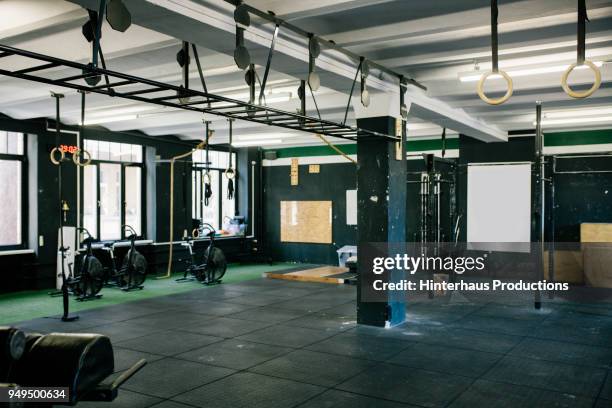 a gym scene with various equipment - gymnastique photos et images de collection