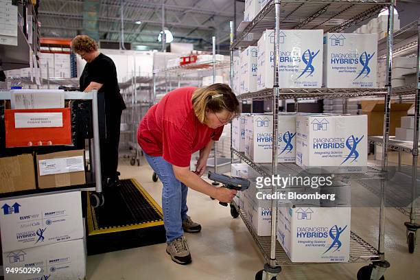 Workers at Diagnostic Hybrids pack boxes containing supplies that will be sent to laboratories for detecting various viruses including the H1N1...