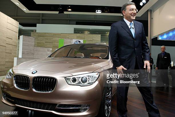Norbert Reithofer, chief executive officer of Bayerische Motoren Werke AG , poses with a BMW Concept 5er Gran Turismo automobile after a news...