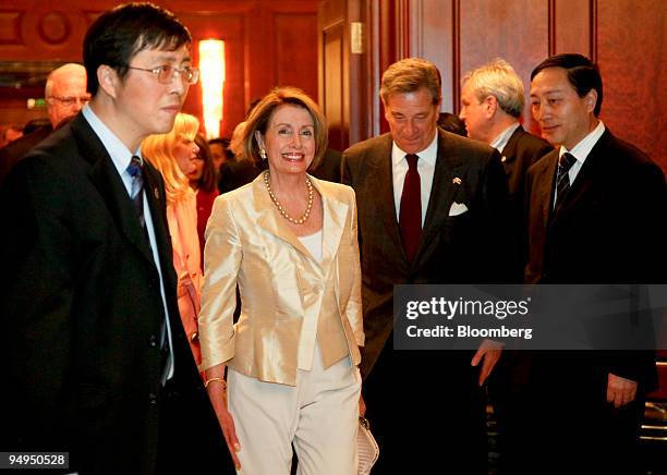Nancy Pelosi, speaker of the U.S. House of Representatives, second from left, arrives for a meeting with Liu Yungeng, chairman of Shanghai's...