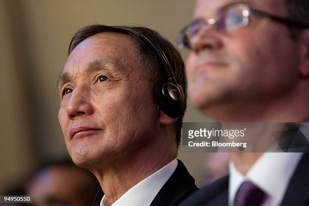 Hou Weigui, chairman of ZTE Corp., center, attends a news conference with Tarek Robbiati, chief executive officer of CSL Ltd., in Hong Kong, China,...