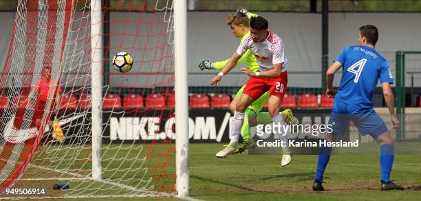 Anton Ruecker of Leipzig scores the second goal, Goalkeeper Julian Muessigbrodt of Magdeburg without a chance during the B Juniors Bundesliga...