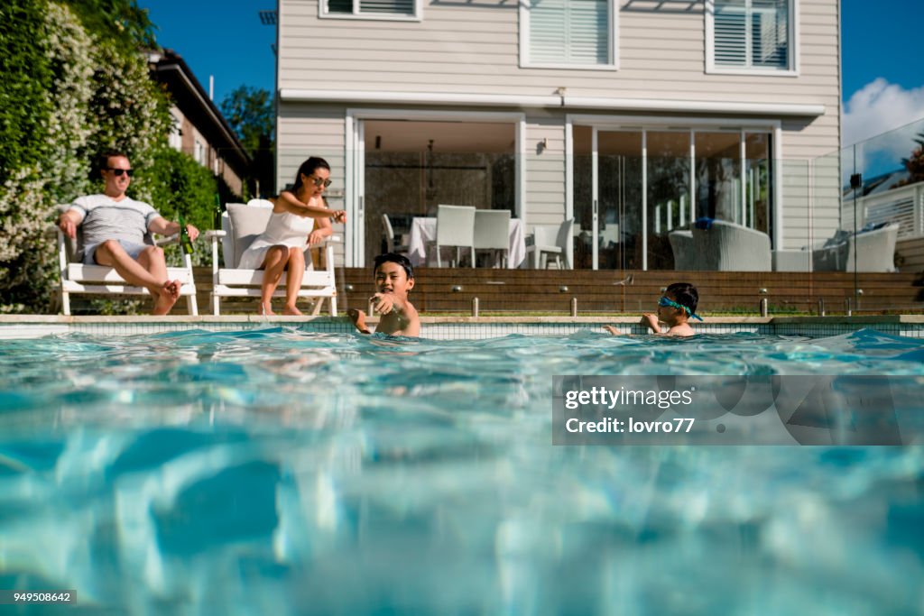 Family having fun in the pool